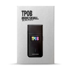 TPOB shaver held in hand to show pocket-size scale and travel convenience