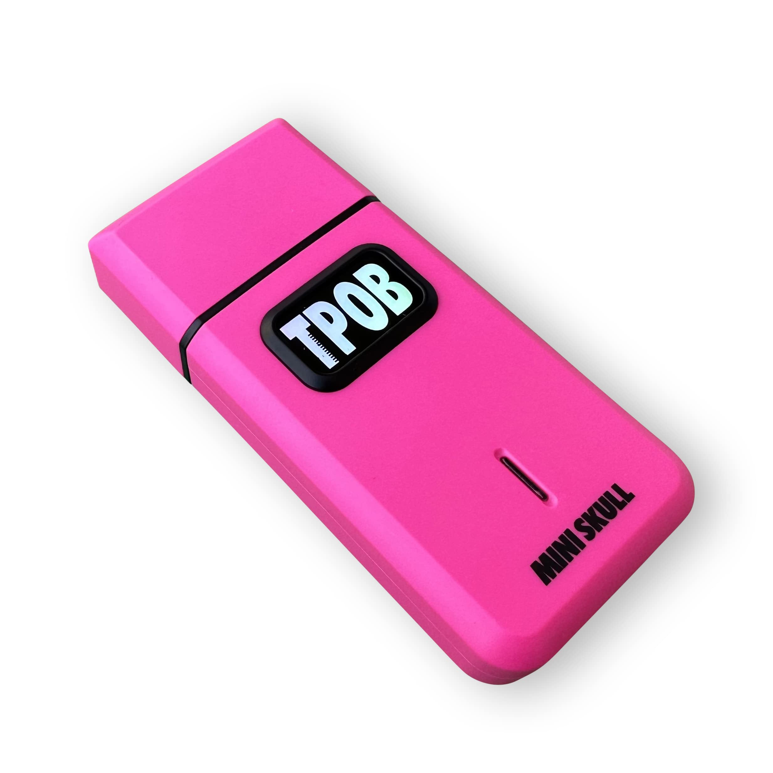 TPOB Mini Skull next to a phone showing pocket-size scale advantage
