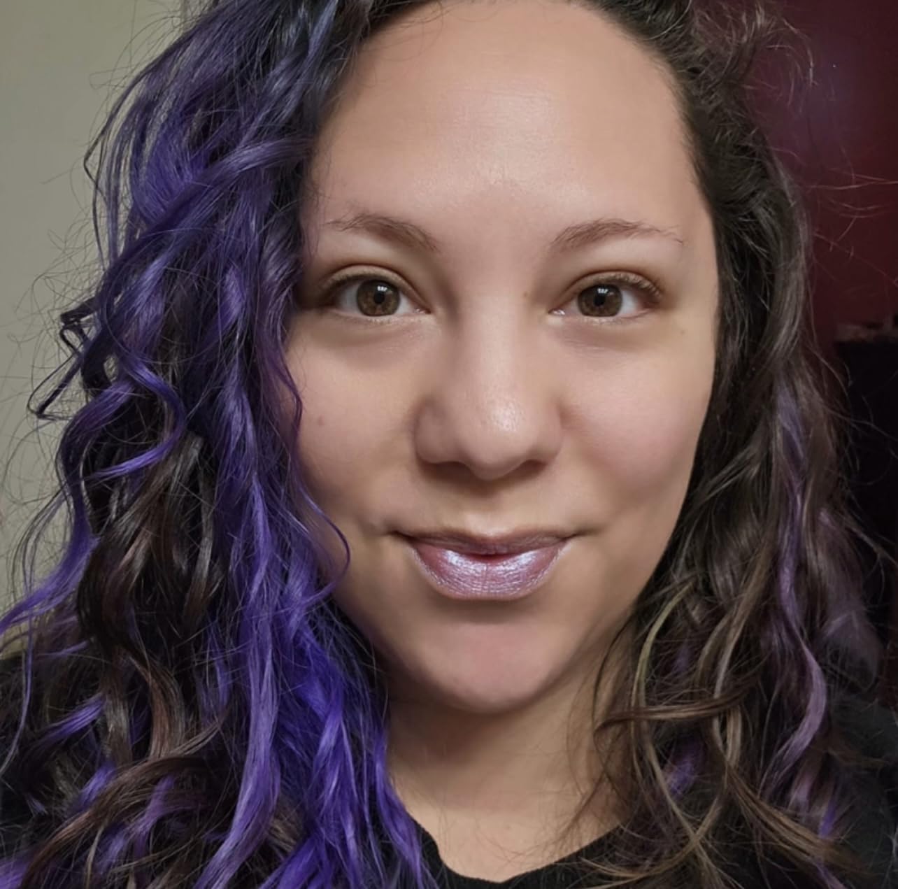 TREAT balm applied on lips displaying mermaid shimmer and hydrated look benefit