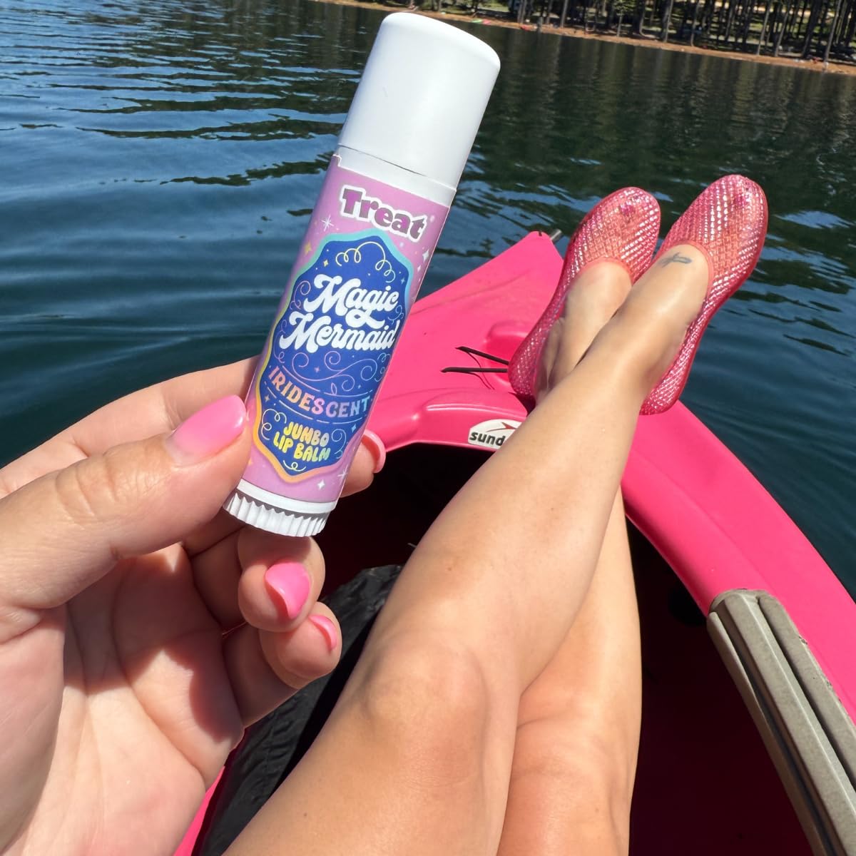 TREAT lifestyle beach scene with balm conveying playful mermaid aesthetic benefit