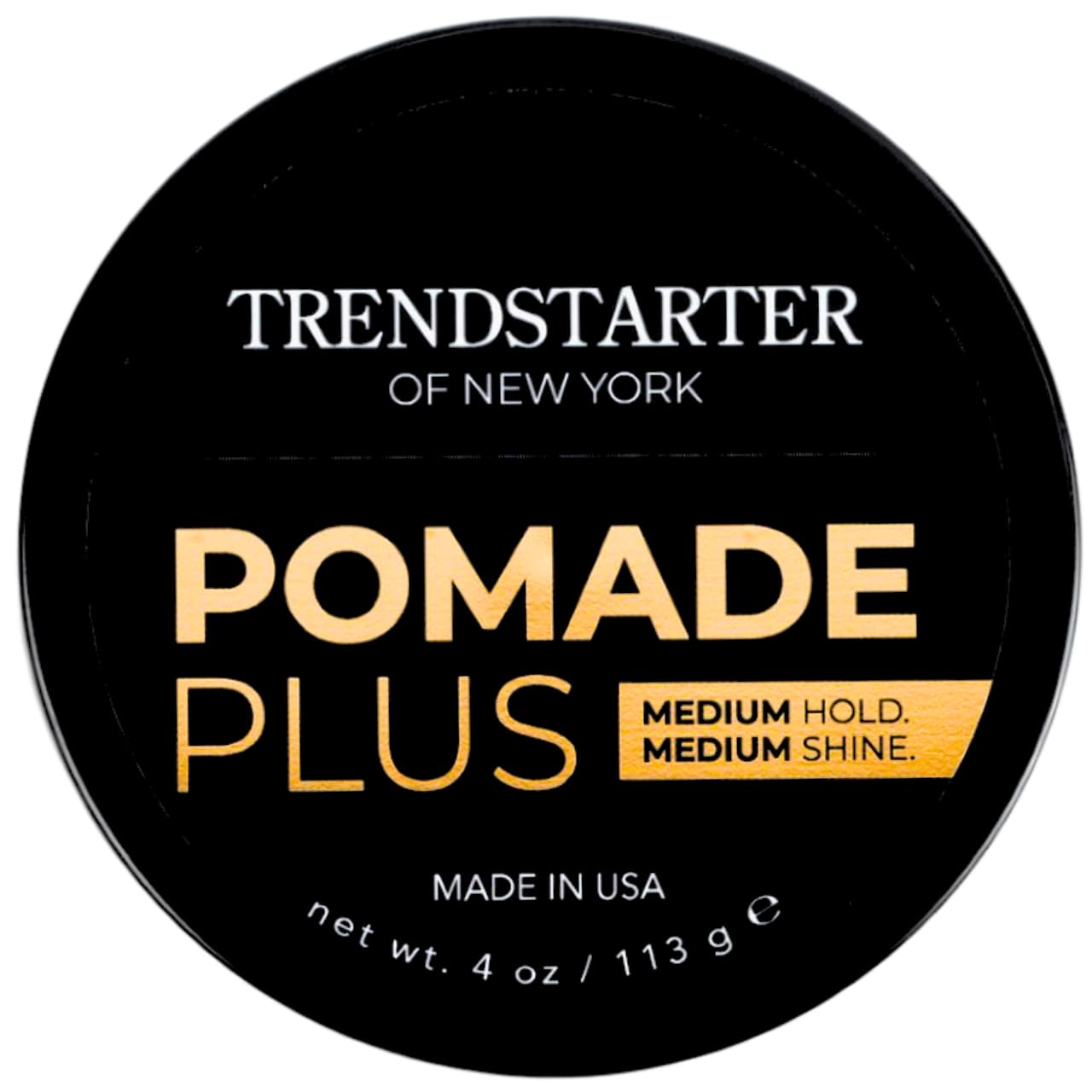 TRENDSTARTER pomade next to a hand for scale showing compact travel-friendly size