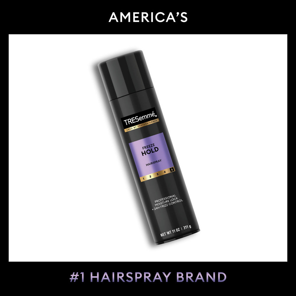 TRESemmé securing an elegant updo in a salon setting for long-lasting hold