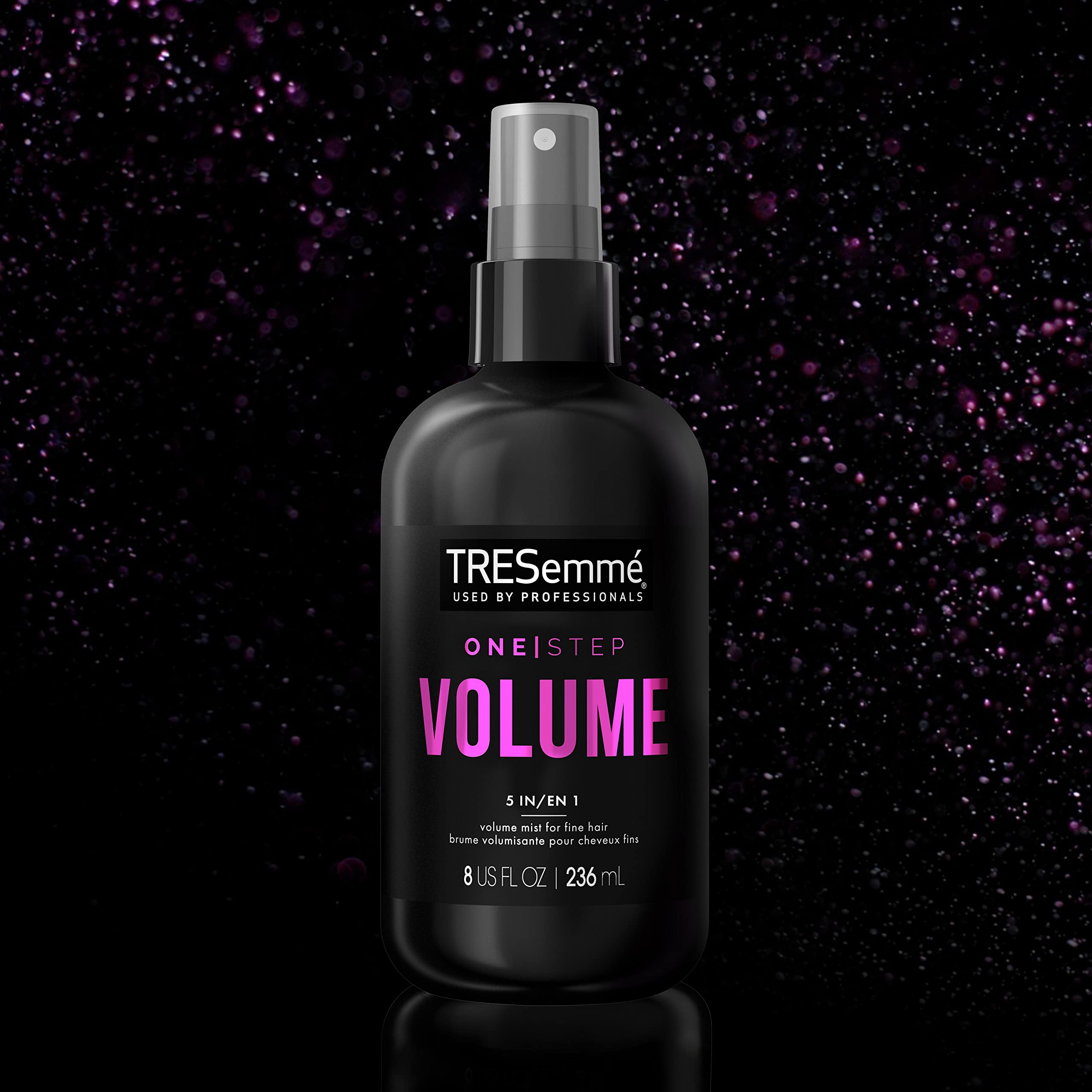 TRESemmé stylist blow-drying hair with round brush for lift