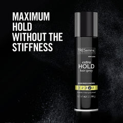 TRESemmé spraying over styled hair to lock in style and reduce frizz