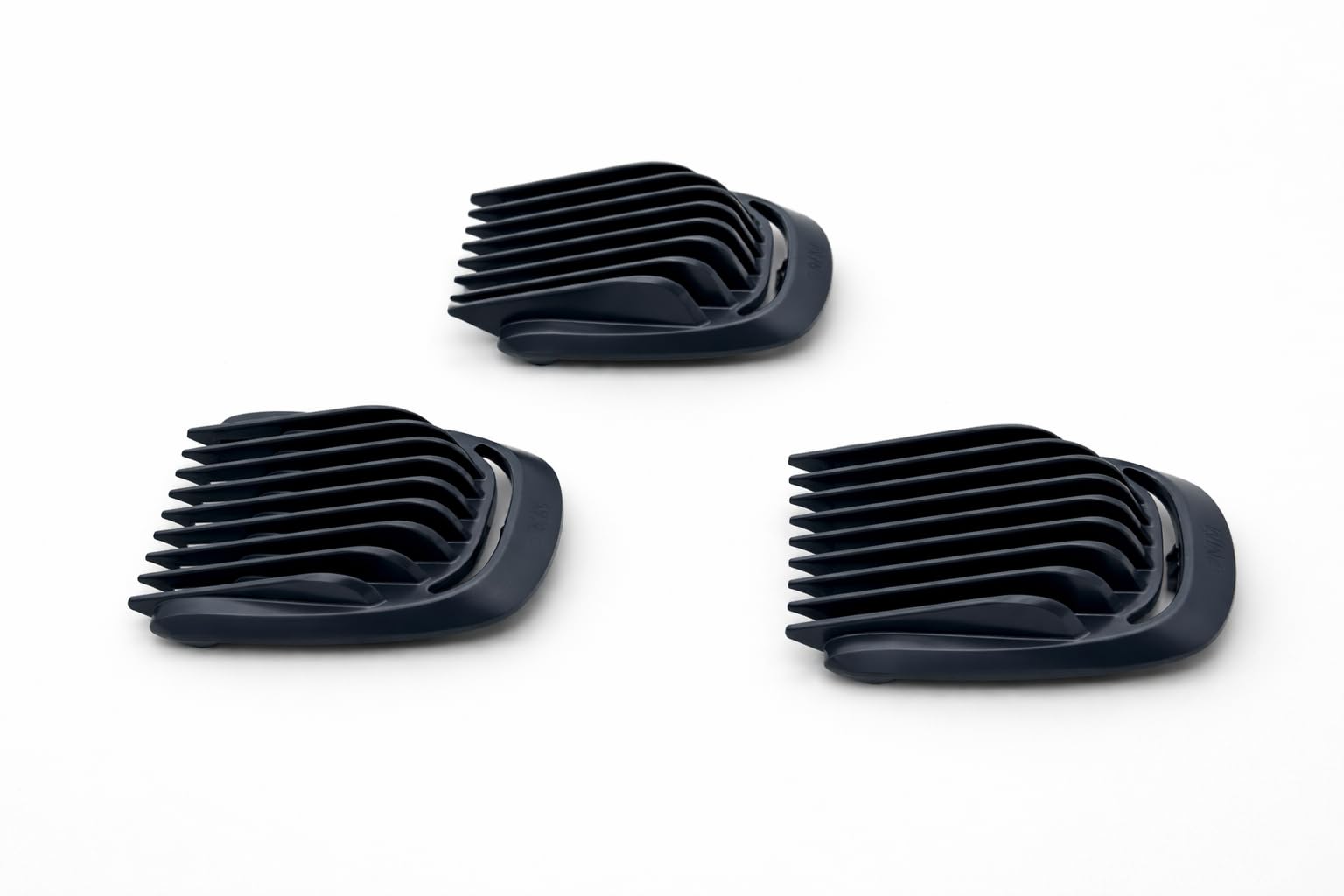 Included small comb next to guards showing Trimmer easy touch-ups