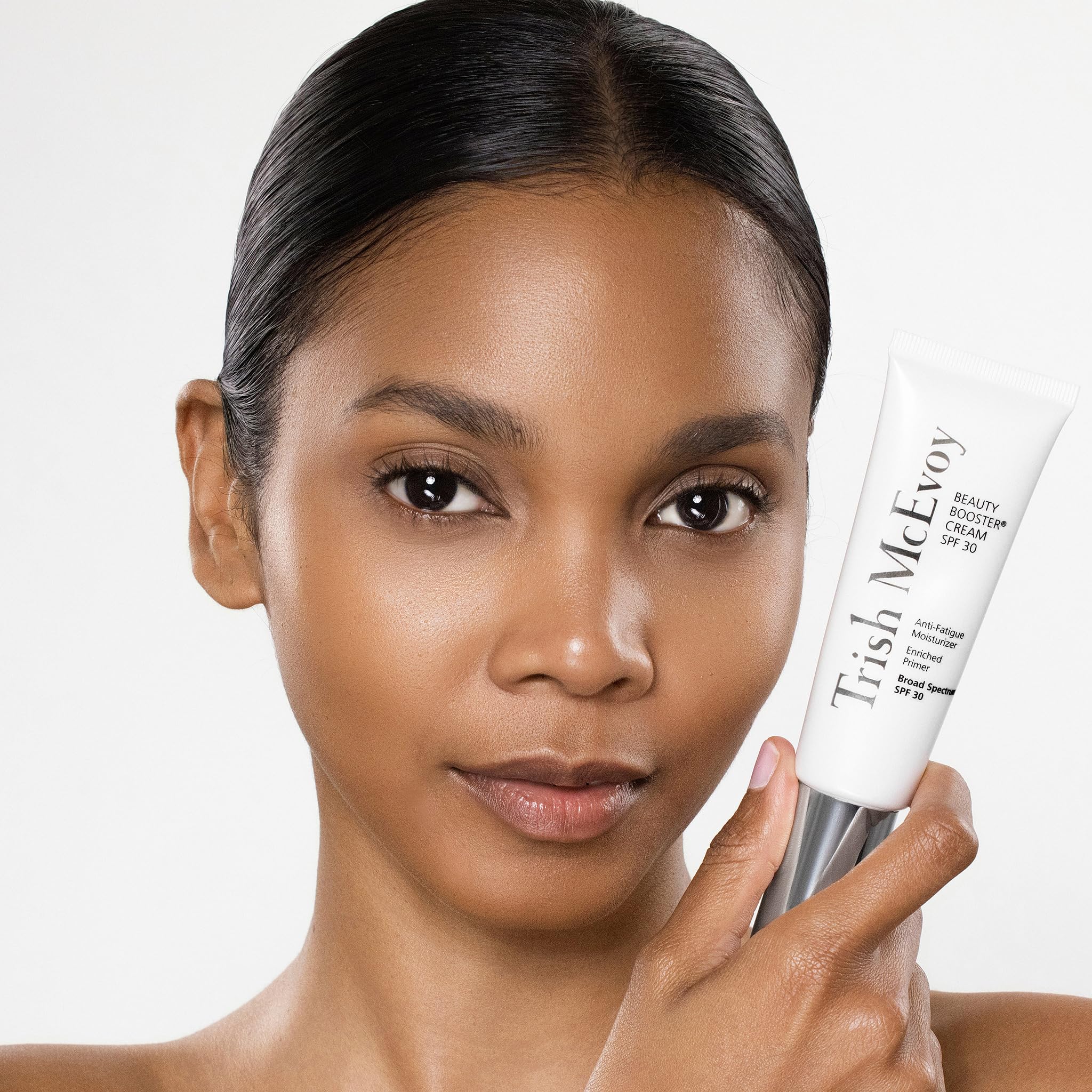 Trish McEvoy applied on cheek demonstrating hydration and priming benefit before makeup