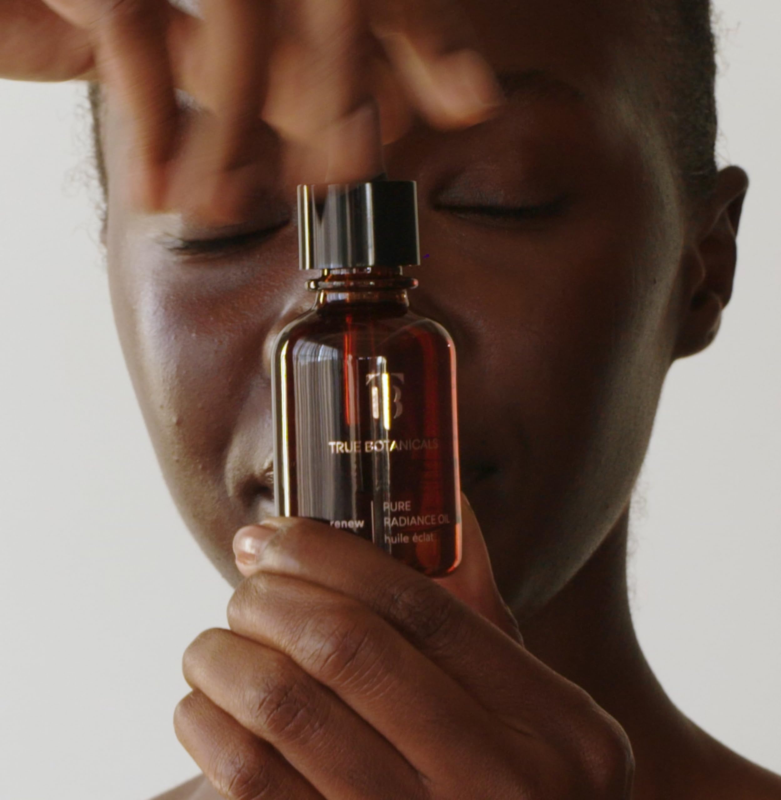 True Botanicals bottle on vanity in lifestyle scene showing daily ritual use