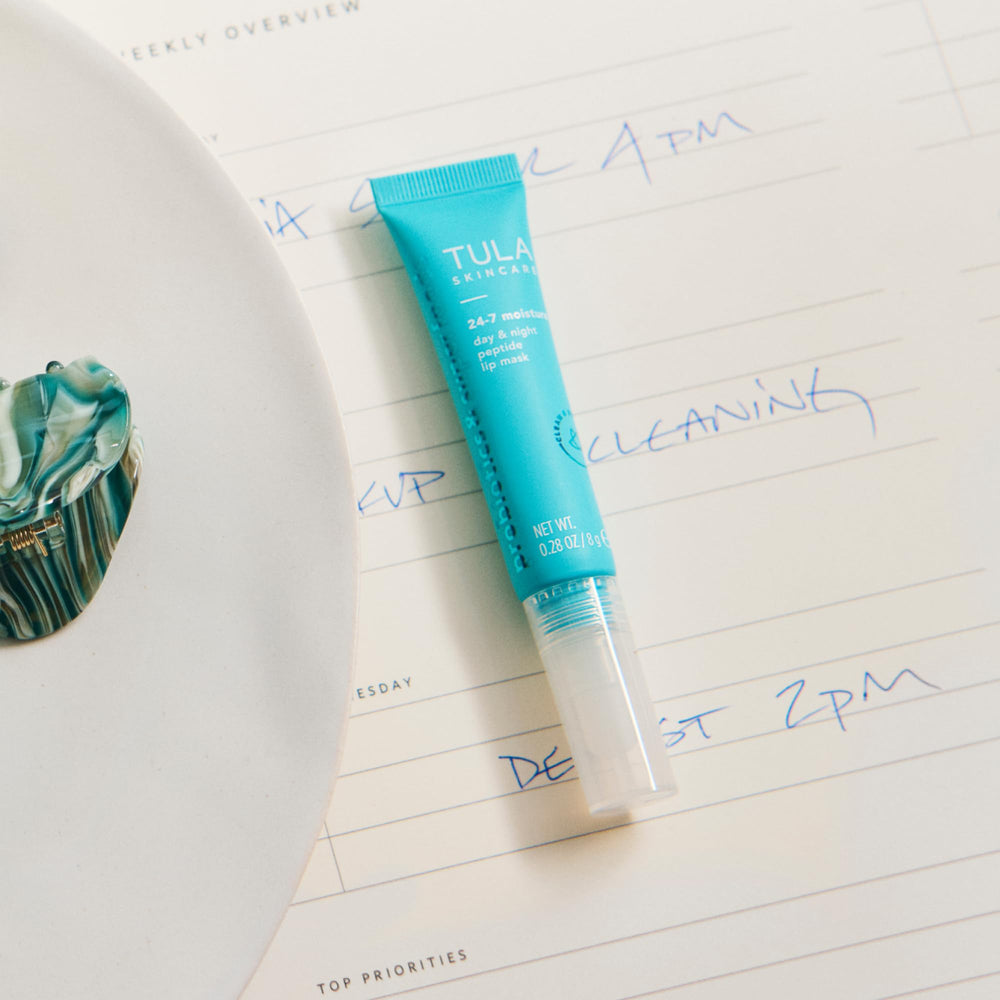 Label close-up on TULA packaging emphasizing active ingredients benefit: hyaluronic acid and vitamin E