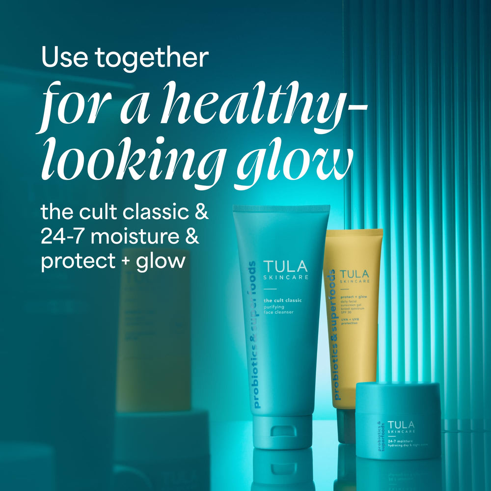 TULA tube held in hand to show 3.38 oz size and travel convenience