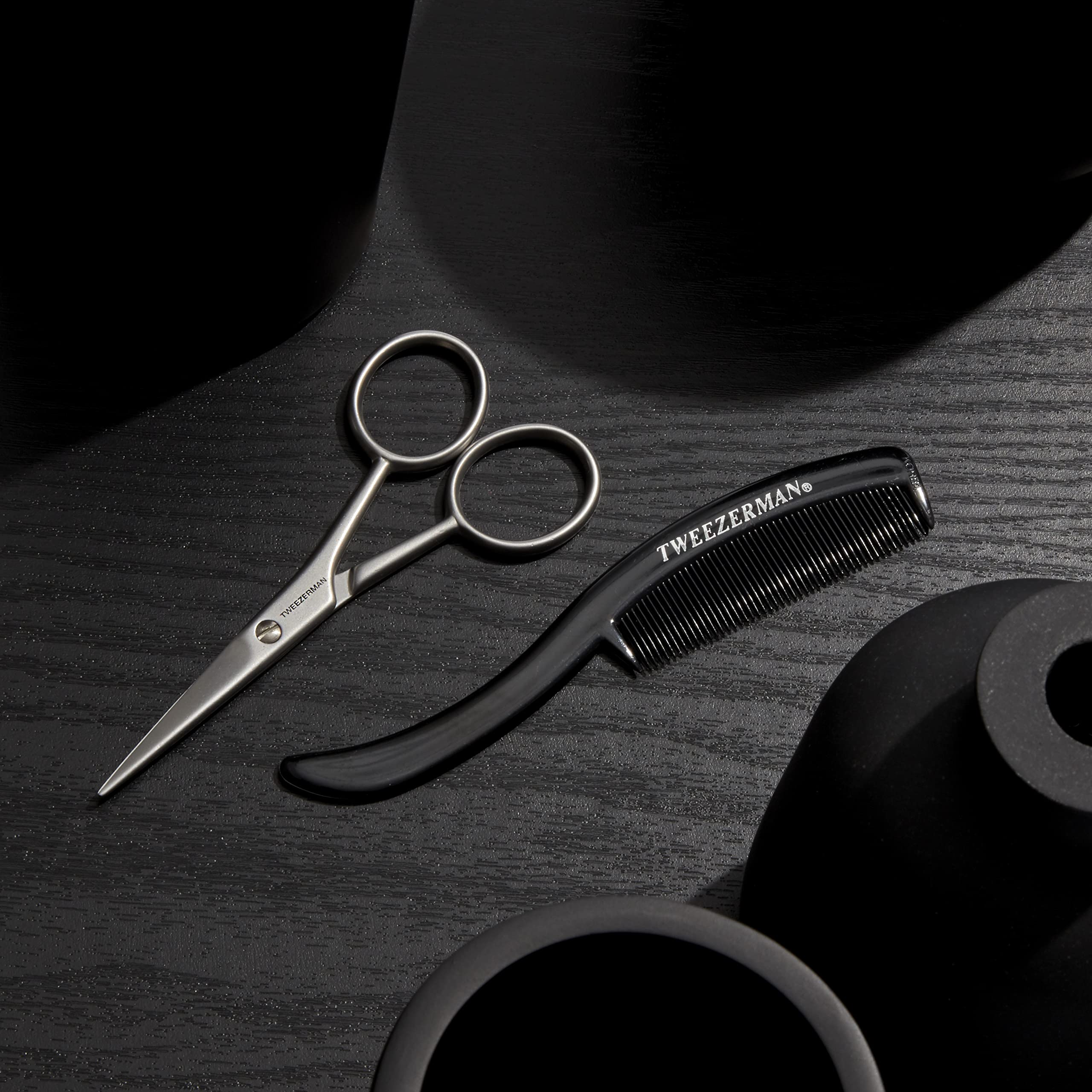 Tweezerman comb and scissors side-by-side illustrating set completeness for routine maintenance