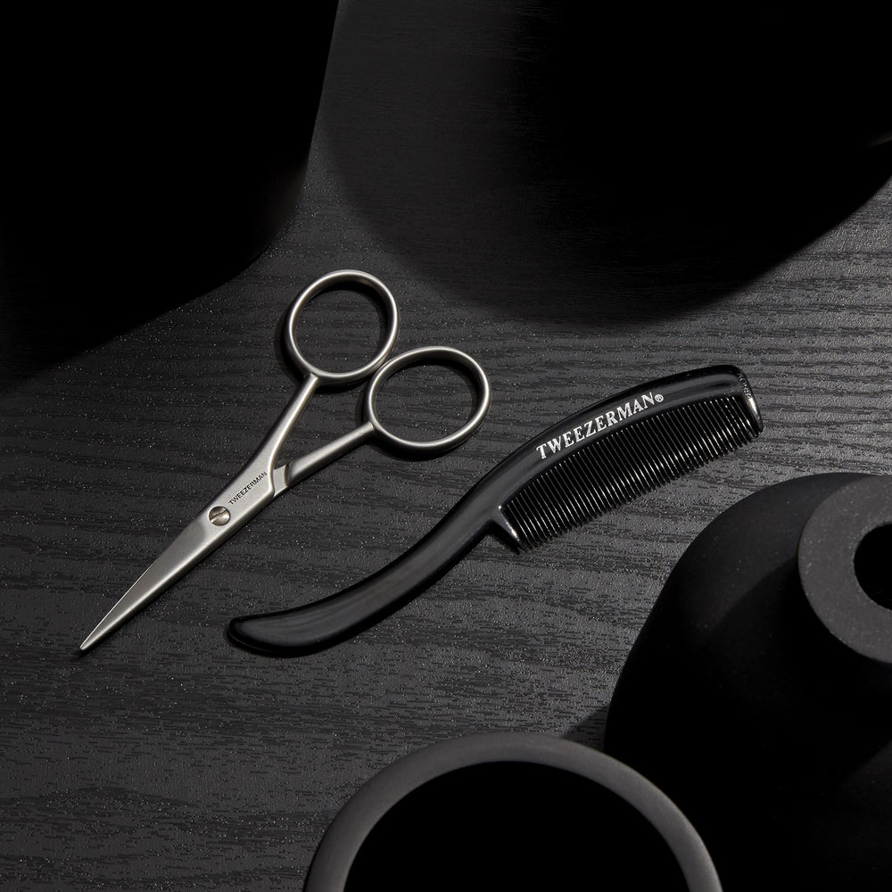 Tweezerman comb and scissors side-by-side illustrating set completeness for routine maintenance