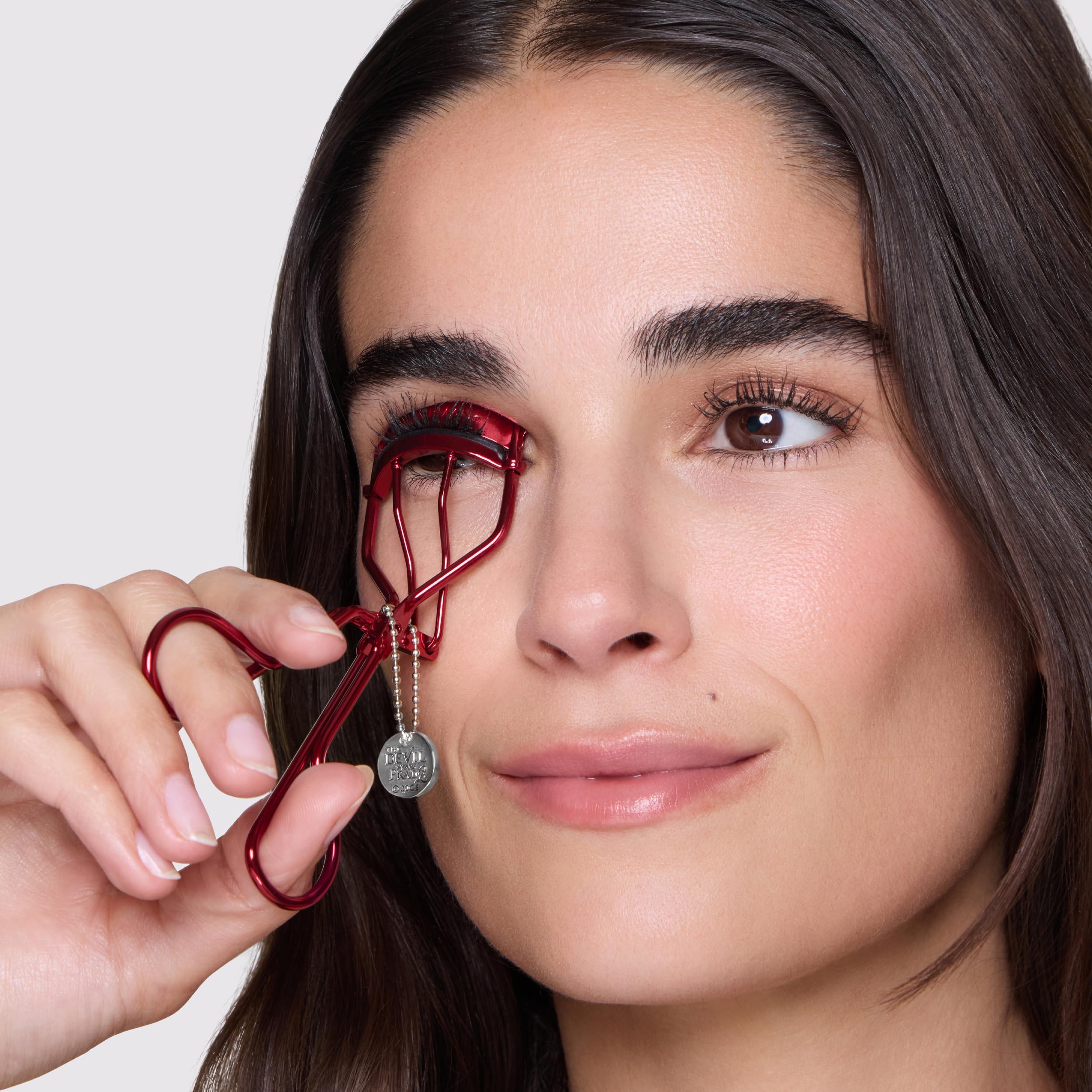 Tweezerman curler on vanity near mirror showing lifestyle use benefit: everyday beauty tool
