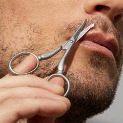 Tweezerman ergonomic handle grip demonstrating large finger loops for comfort