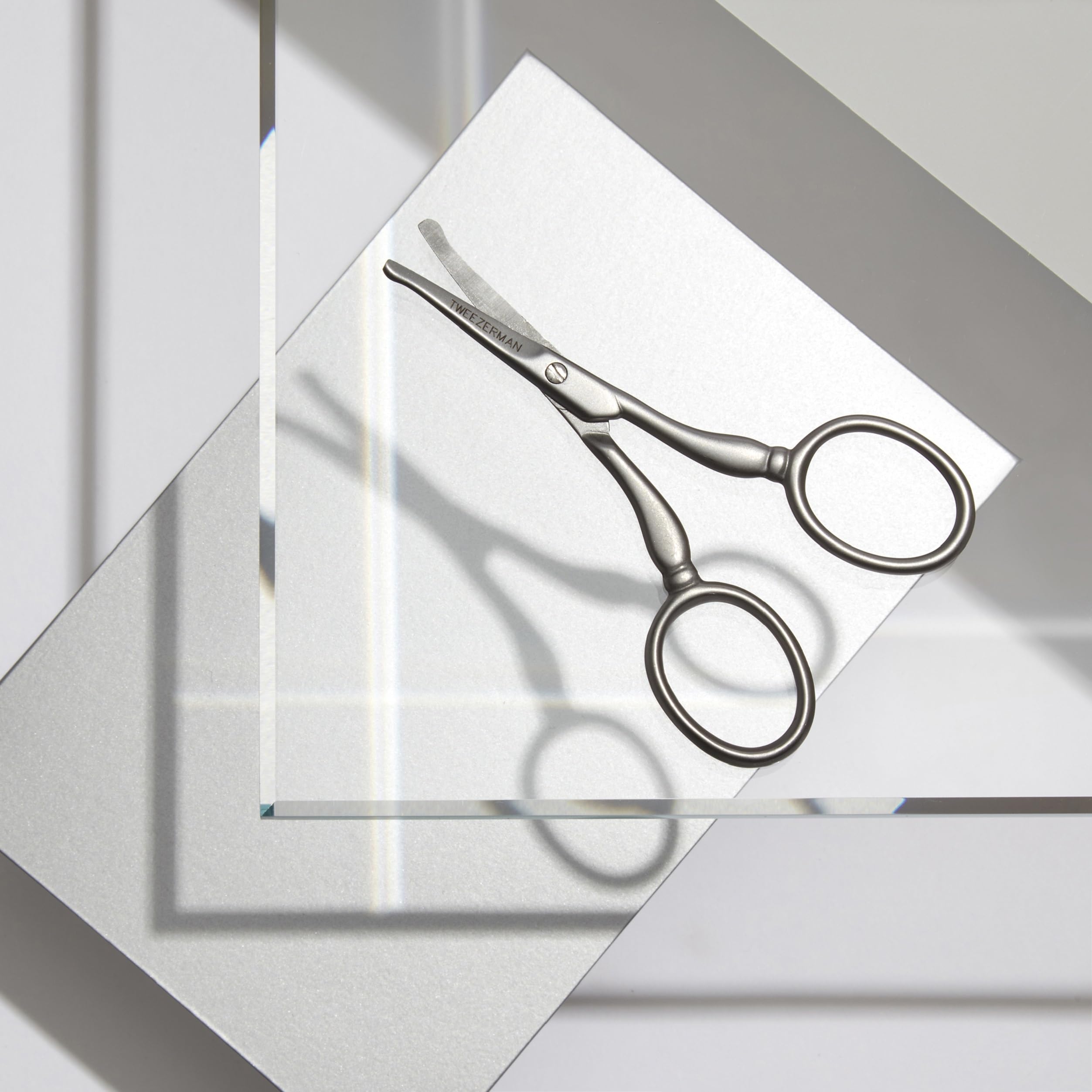 Tweezerman in-ear trimming demonstration showing careful short-tip insertion benefit