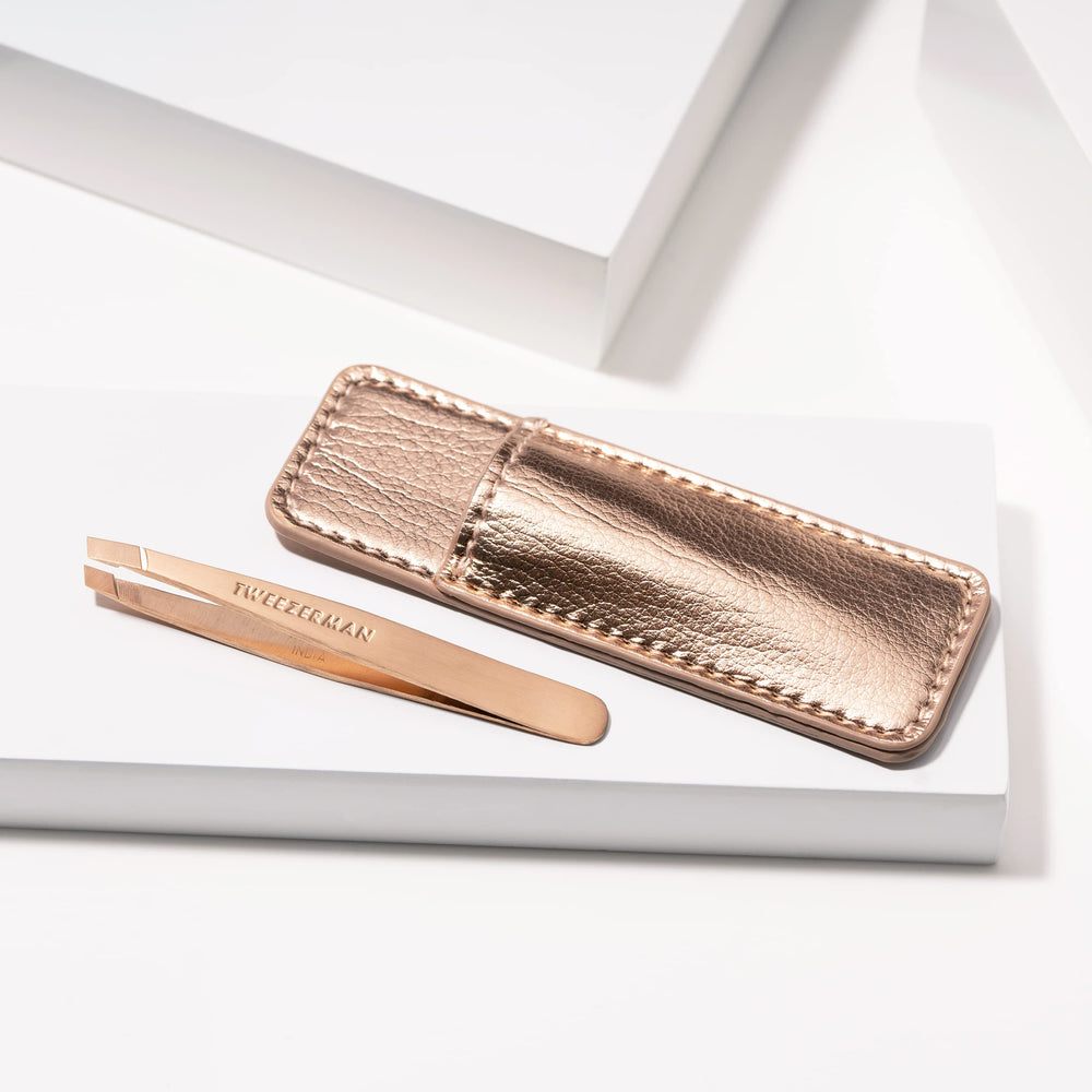 Tweezerman mini beside credit card showing travel-friendly compact size benefit
