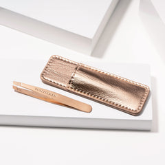 Tweezerman mini beside credit card showing travel-friendly compact size benefit