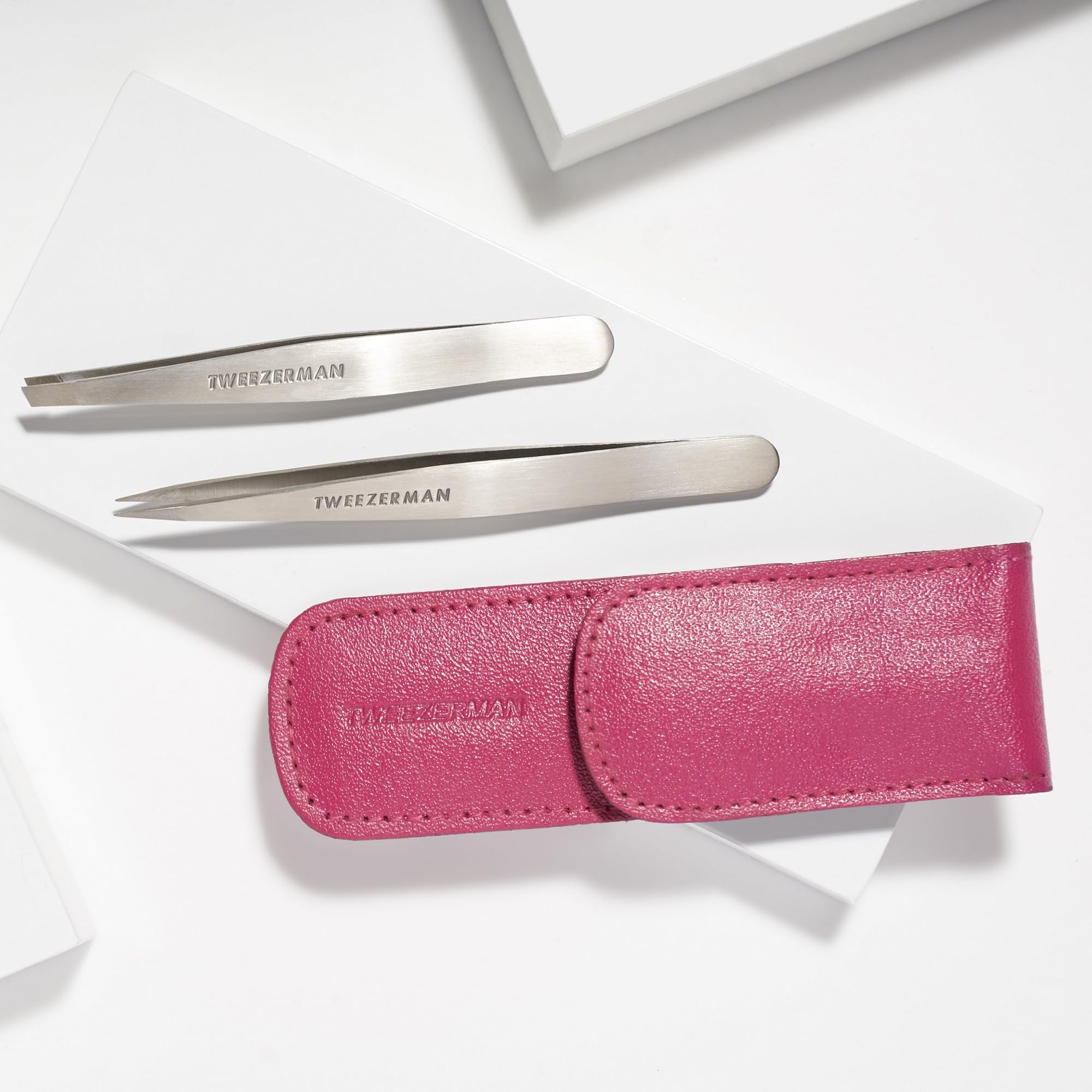Tweezerman pink travel pouch zipper closeup protecting tools on the go