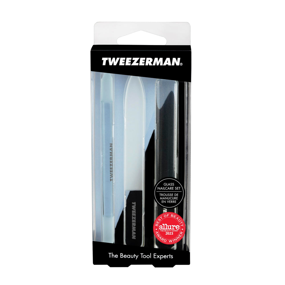 Tweezerman pushy clearing around nail edges to remove debris and tidy cuticles