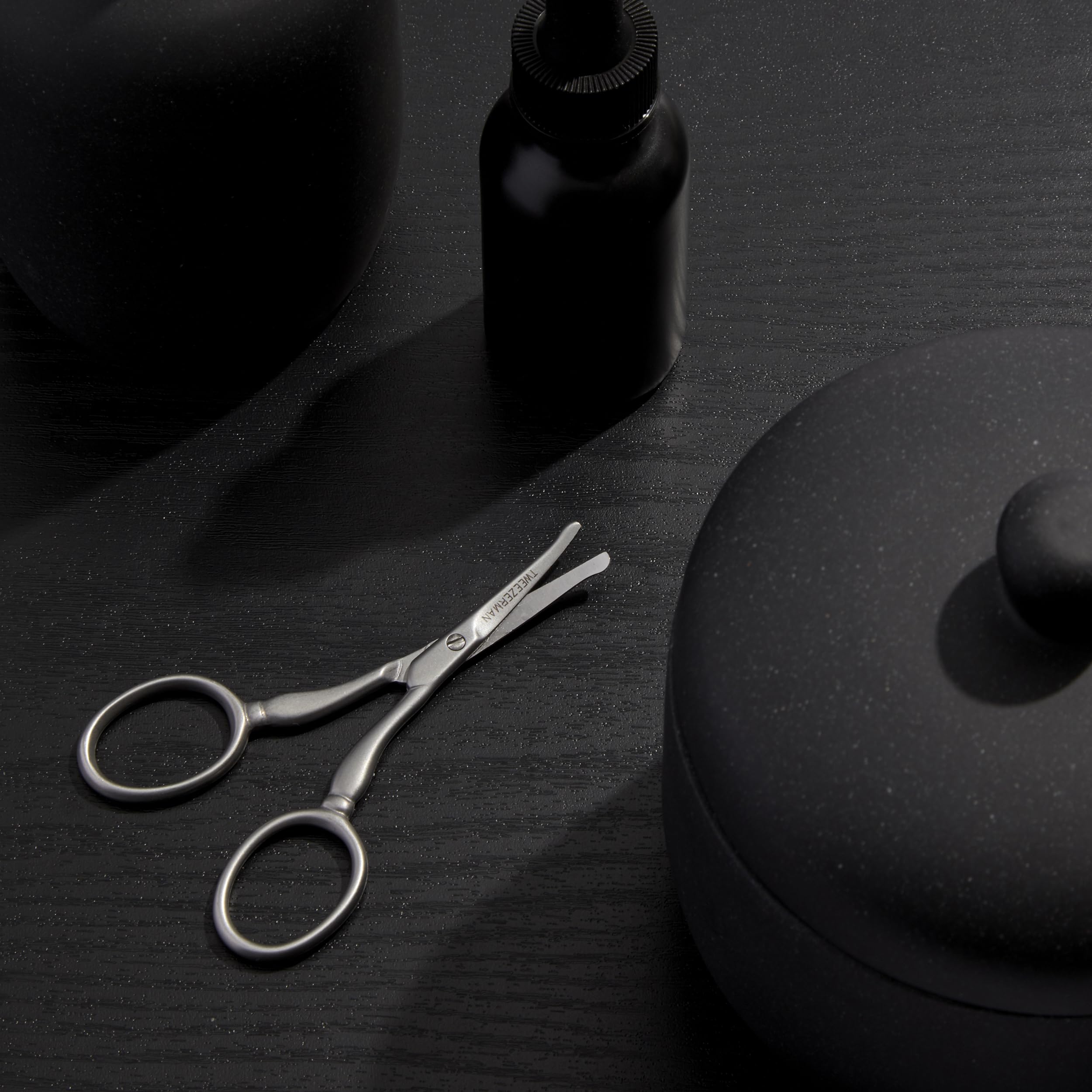 Tweezerman size comparison with coin conveying compact travel-friendly scale