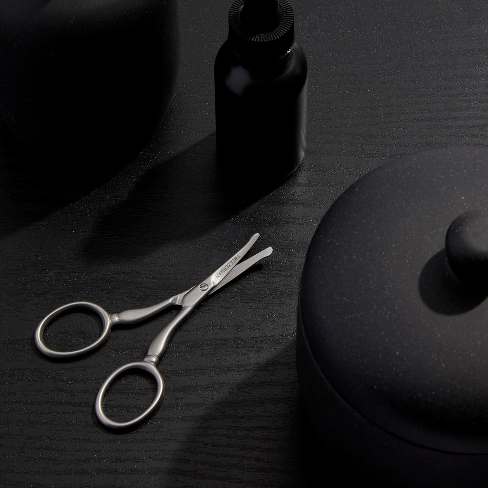 Tweezerman size comparison with coin conveying compact travel-friendly scale