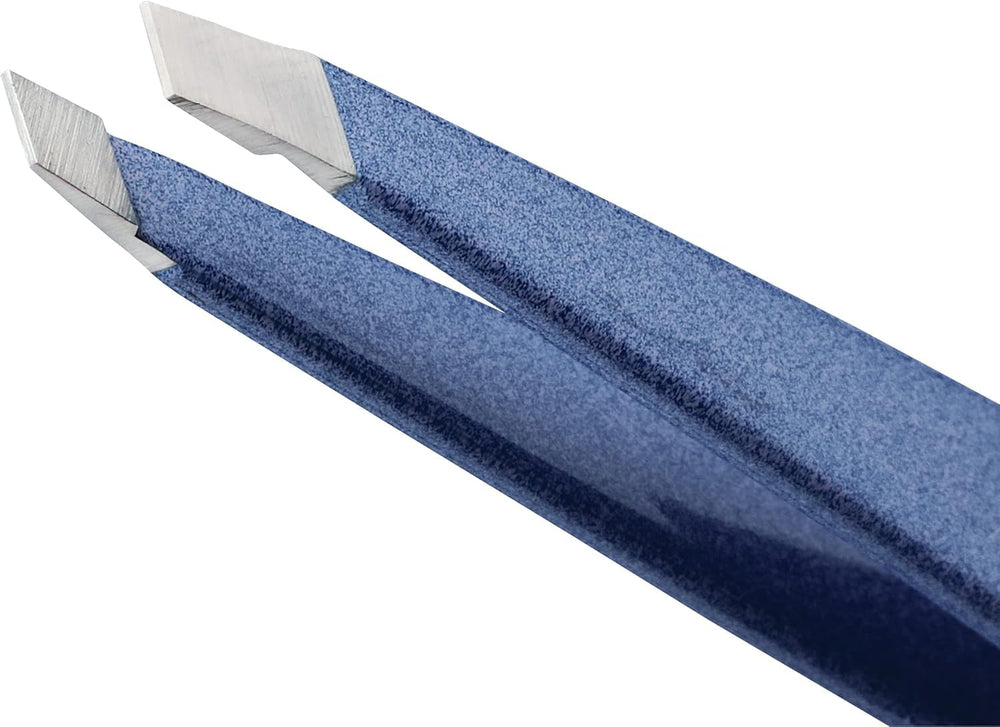 Tweezerman close-up of hand-filed slanted tip showcasing alignment benefit: secure hair grip