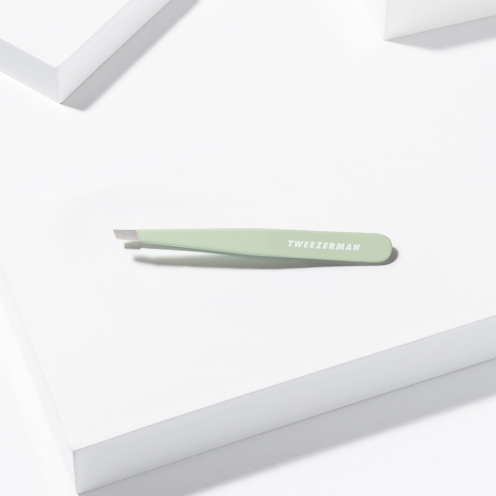 Tweezerman pistachio tweezer with alcohol wipe demonstrating hygienic care