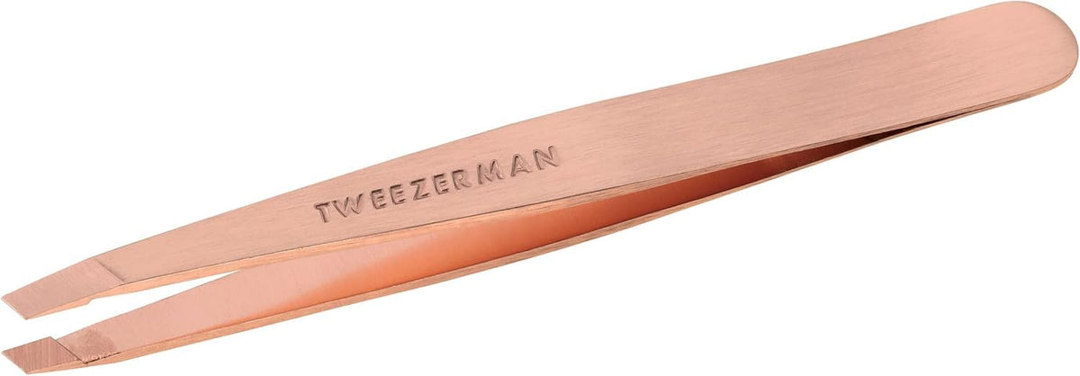 Tweezerman rose gold slant tweezer front view shows polished finish and ergonomic shape for precise grooming