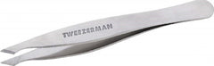 Tweezerman front view showing compact stainless steel body and ergonomic shape for precise control