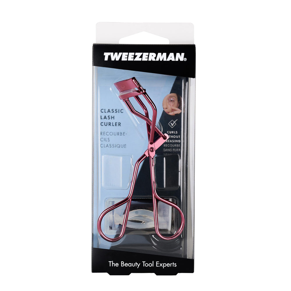 Tweezerman tea rose curler next to ruler showing compact size and easy travel
