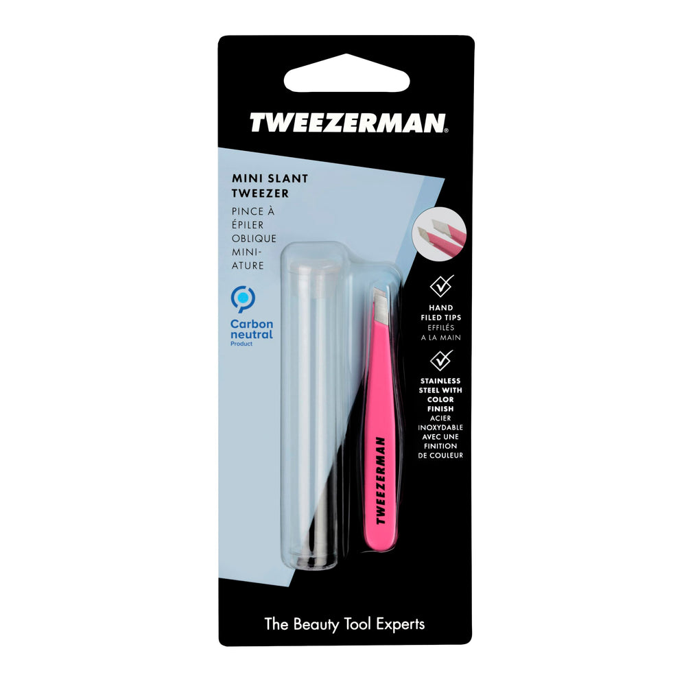 Tweezerman on vanity with cosmetics showing neon pink tweezer as a travel-ready styling essential