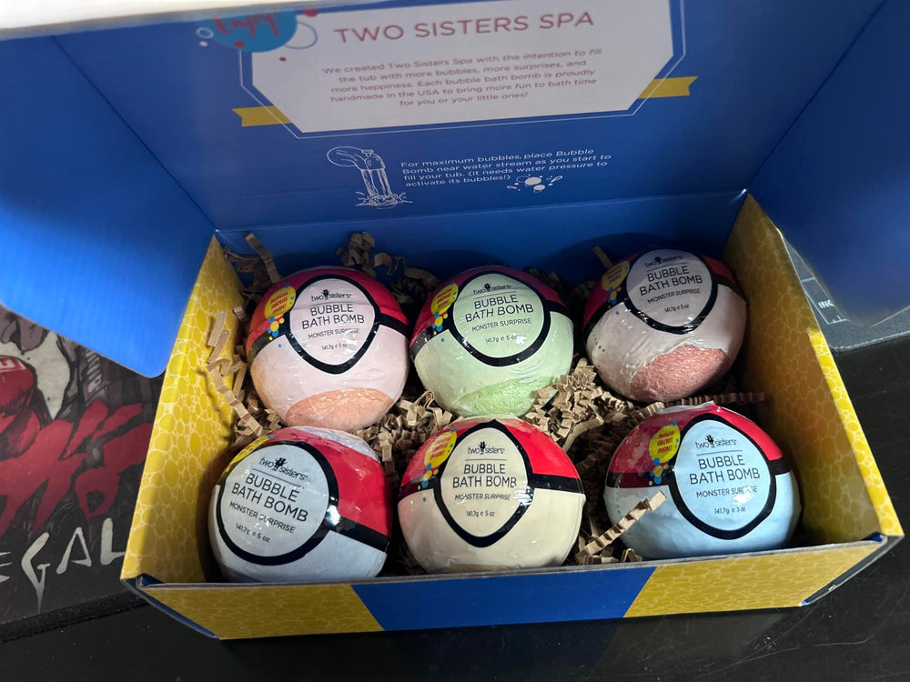 Top-down view of Two Sisters six bath bombs highlighting variety and bright colors