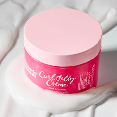 Umberto Giannini applying crème to damp hair to encourage clumping