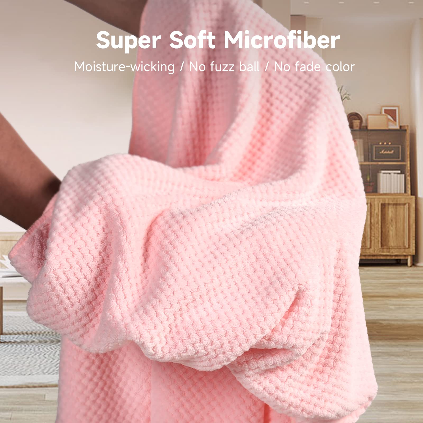 Umisleep oversized towel next to regular towel showing larger coverage for long hair