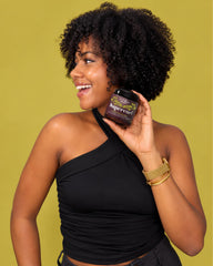 Uncle Funky's Daughter applying creme to wet hair for easy detangling