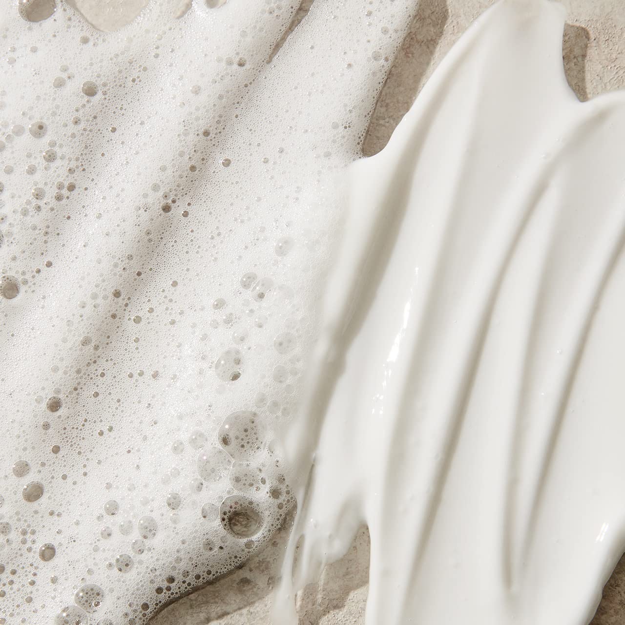 UNITE product being applied in salon to detangle and smooth hair benefit