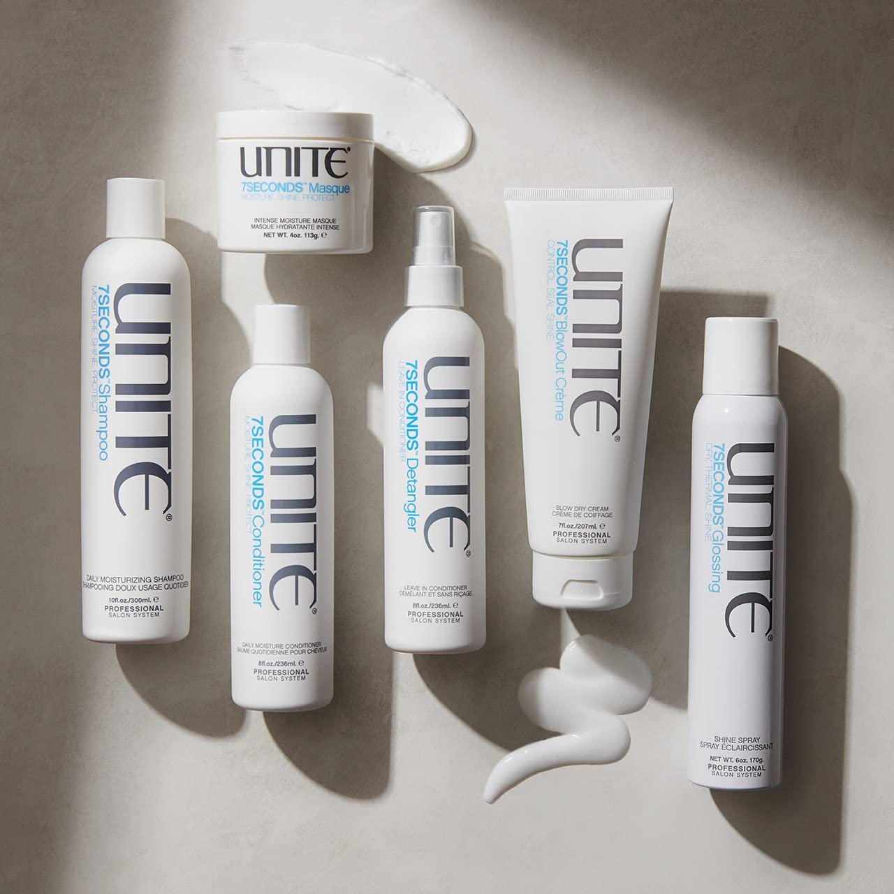 UNITE 7SECONDS Masque 4 oz next to hand for scale showing travel-friendly size