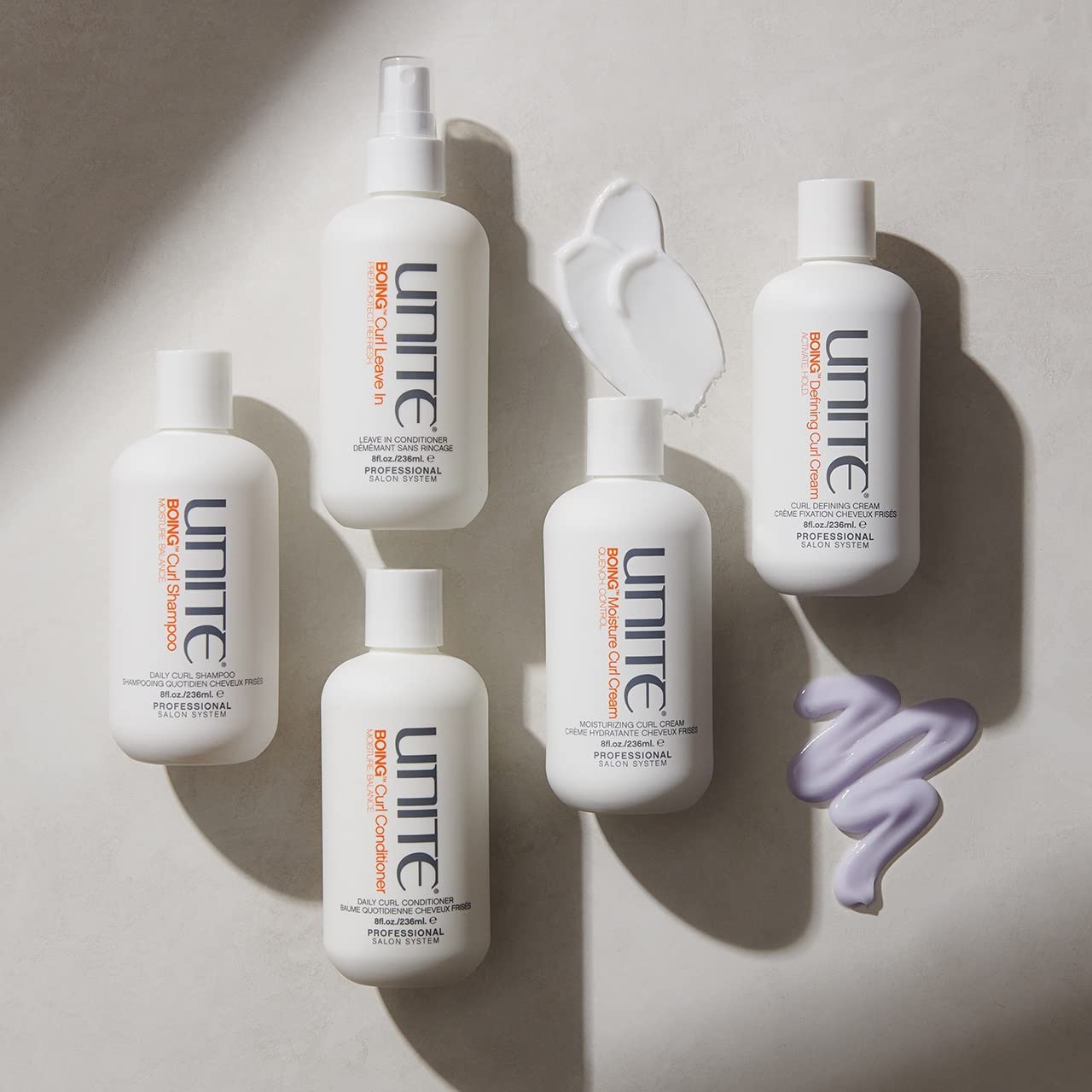 UNITE bottles arranged in salon setting conveying professional styling results