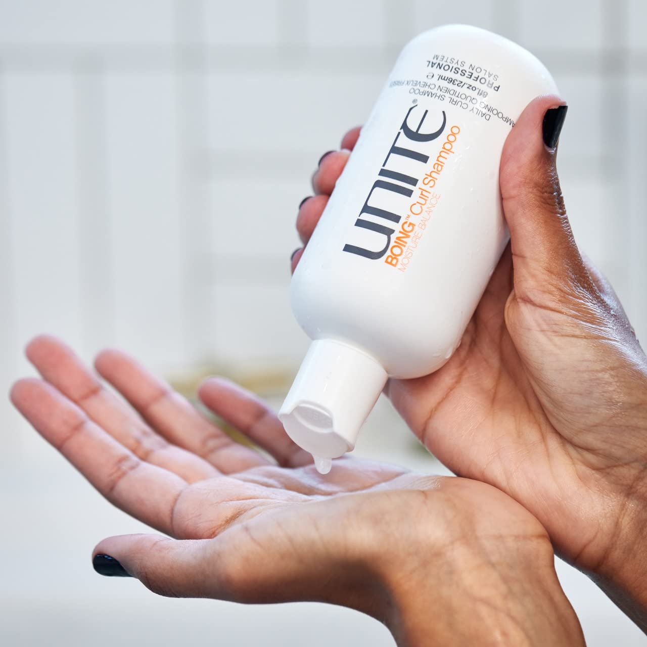 UNITE BOING 8 oz bottle next to common objects to show true size