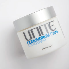 UNITE CONUNDRUM used on styled hair in salon setting showing natural finish benefit