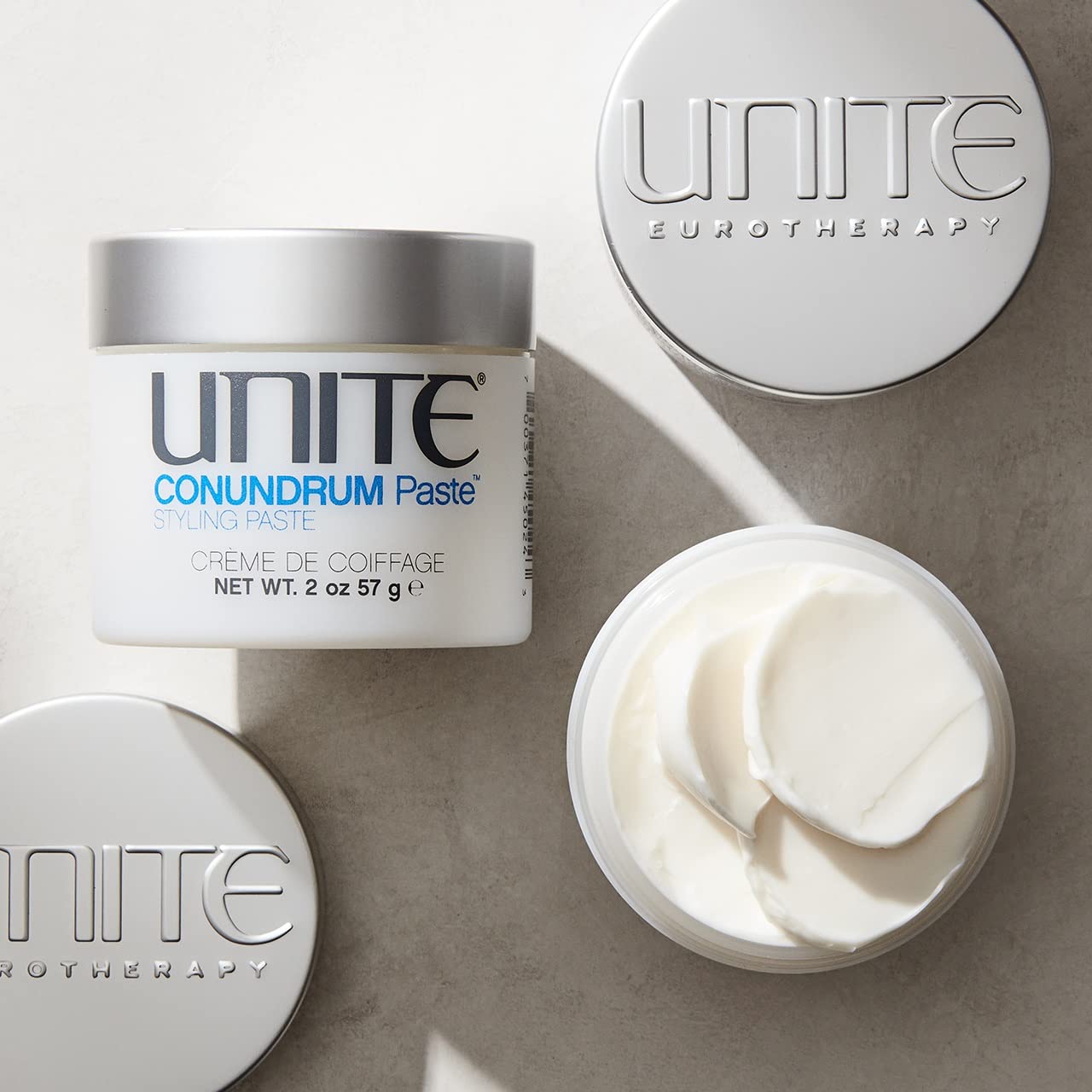 UNITE CONUNDRUM paste texture close-up highlighting creamy waxy consistency benefits