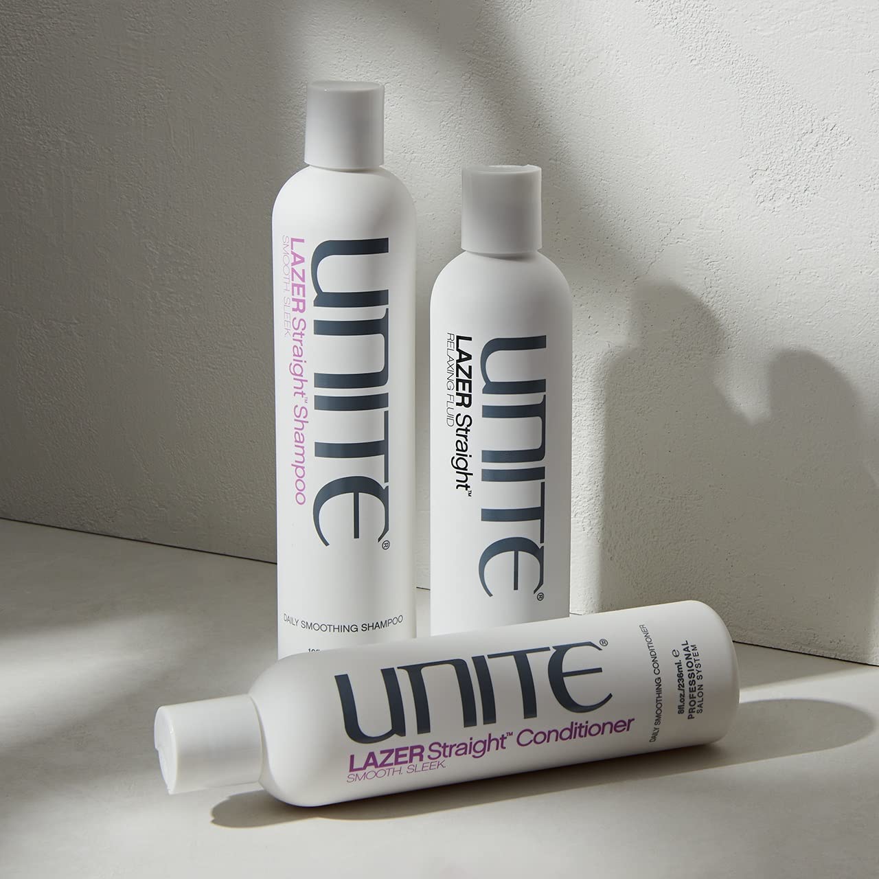 UNITE LAZER used in blowout scene demonstrating frizz control and sleek finish