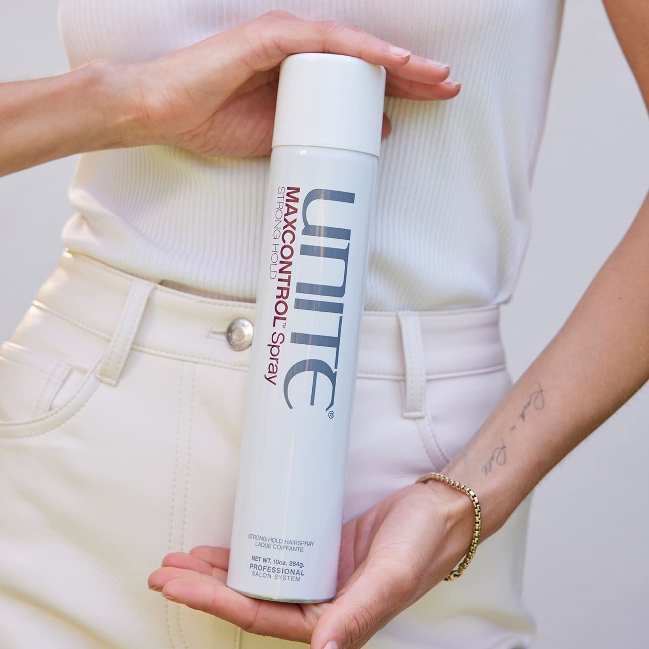 UNITE MAXCONTROL used by stylist on updo offering long-lasting hold benefit