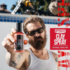 UPPERCUT DELUXE spray being misted into hair to add texture and grit