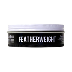 Uppercut Deluxe product on hand ready to apply offering lightweight control benefit