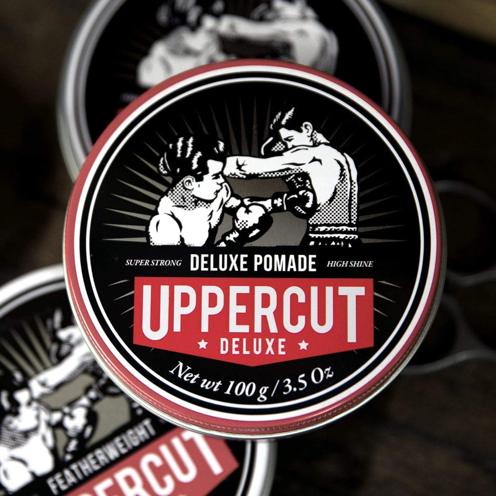 UPPERCUT DELUXE next to a ruler showing 3.5 oz size for scale and travel convenience