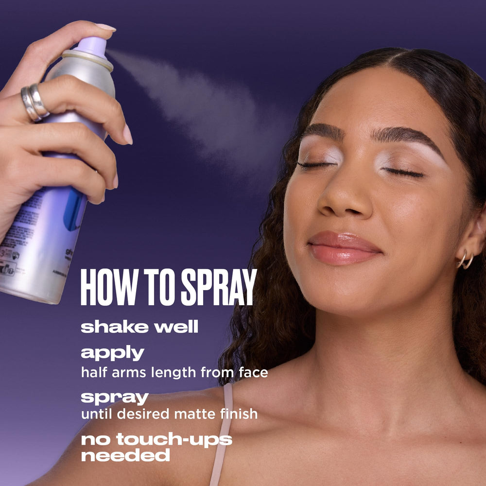 Urban Decay bottle held in hand comparing the 1.4 fl oz travel size