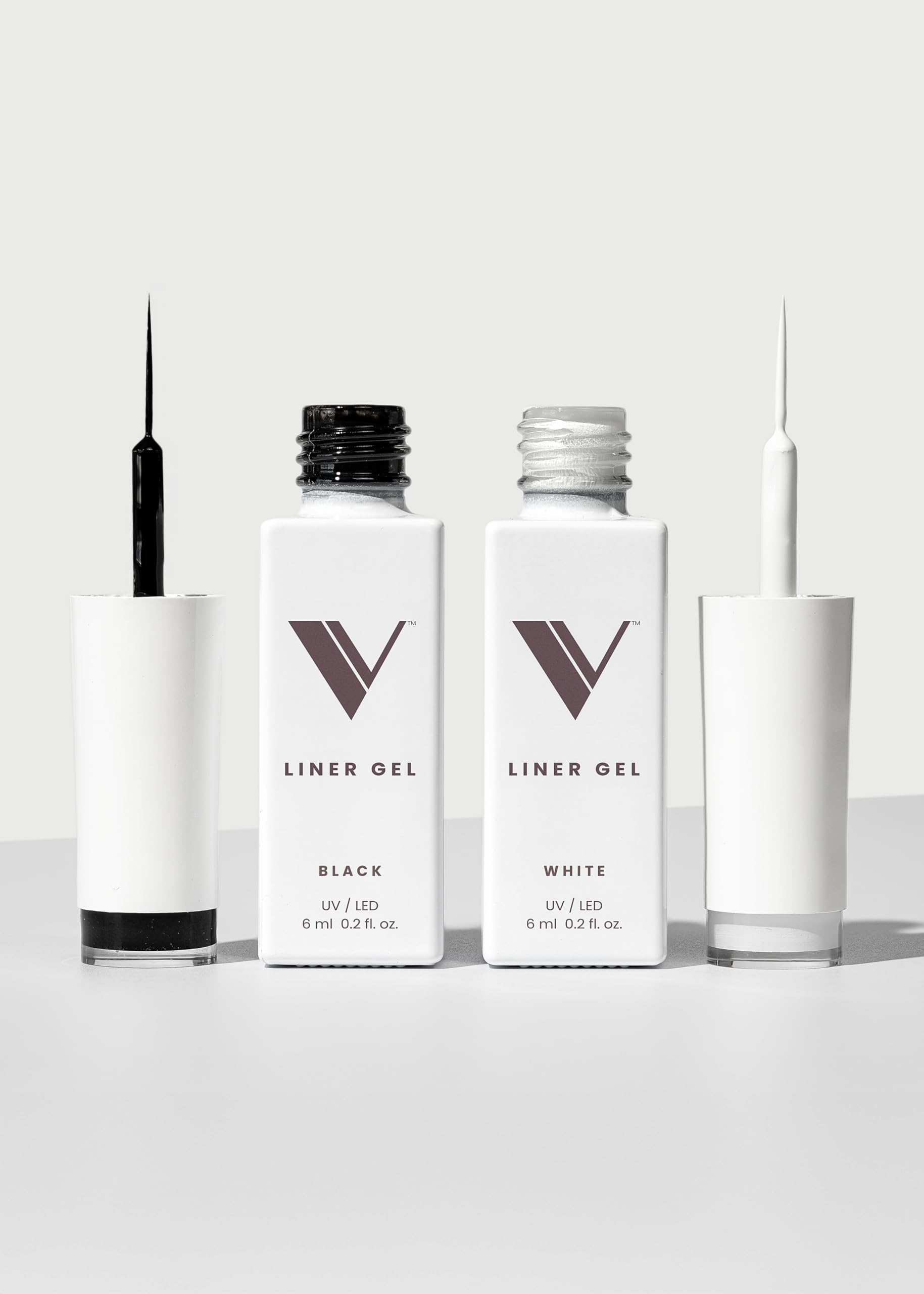 V Beauty Pure front packaging showing black and white liner bottles and benefits