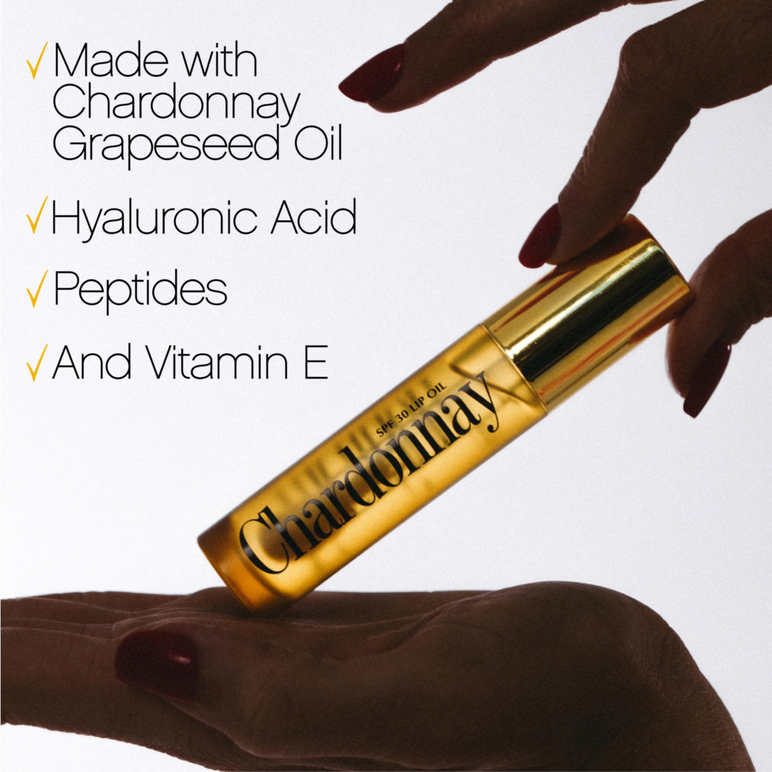 VACATION Chardonnay lip oil in a beach bag lifestyle shot for on-the-go sun protection