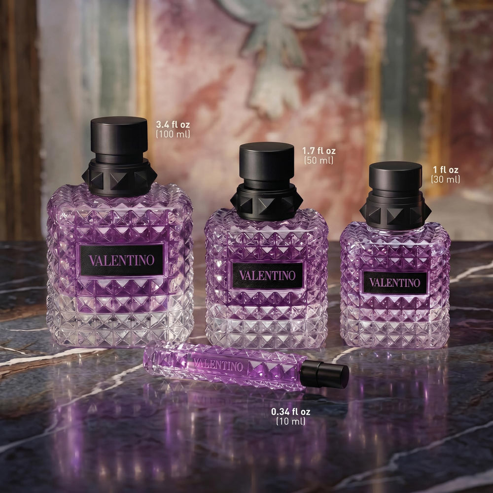 Valentino bottle beside common items to show 3.4 fl oz scale