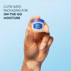 Vaseline mini jar in hand to show size and pocket-friendly benefit